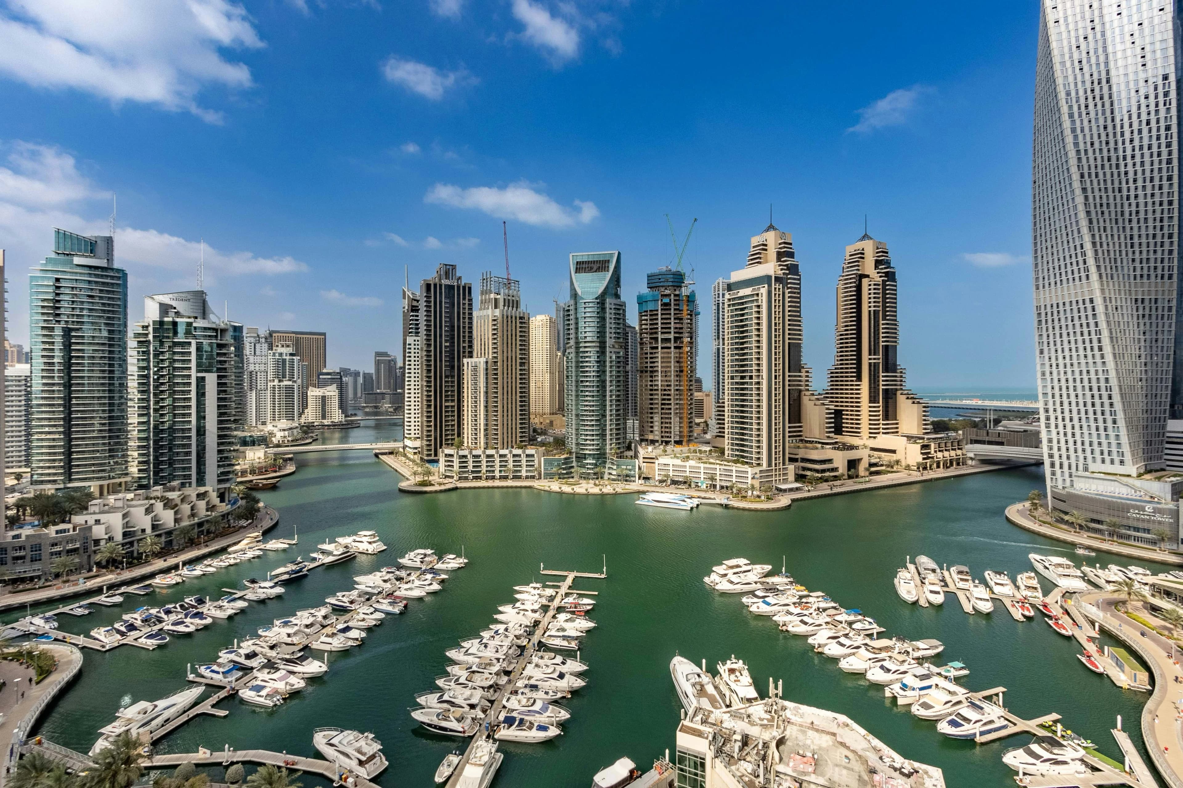 Aerial view of Dubai Marina showing modern skyscrapers and yacht harbor